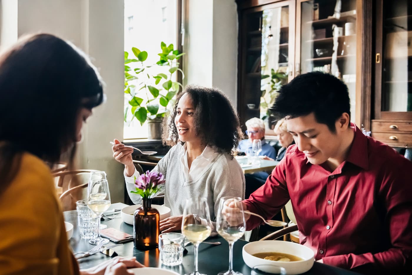 three-people-eating-ramen-at-restaurant
